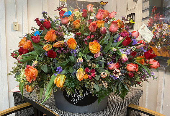 Large floral arrangement by Colonial Gardens