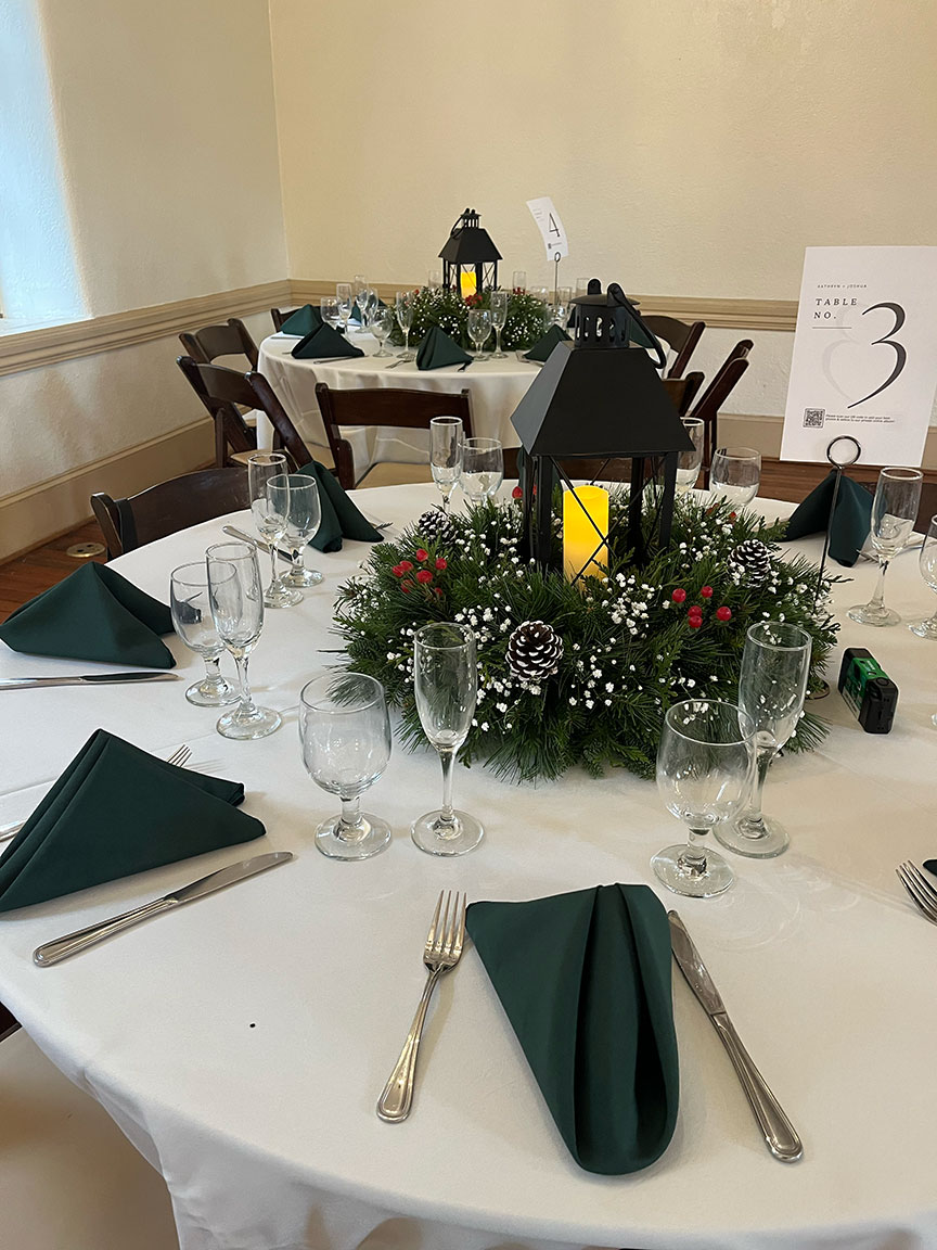 Event table flower arrangements, with lanterns.
