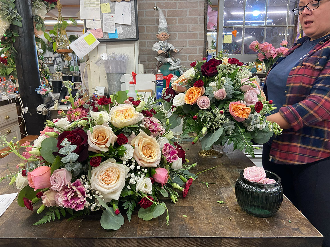 LeeAnn at work creating floral arrangements.