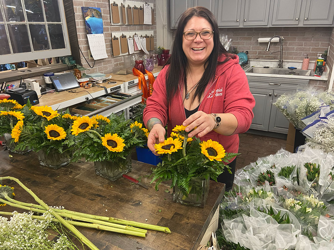 LeeAnn at work creating floral arrangements.