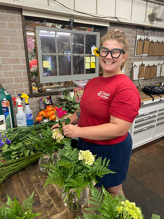 Colonial Gardens assistant florist, Ashley.