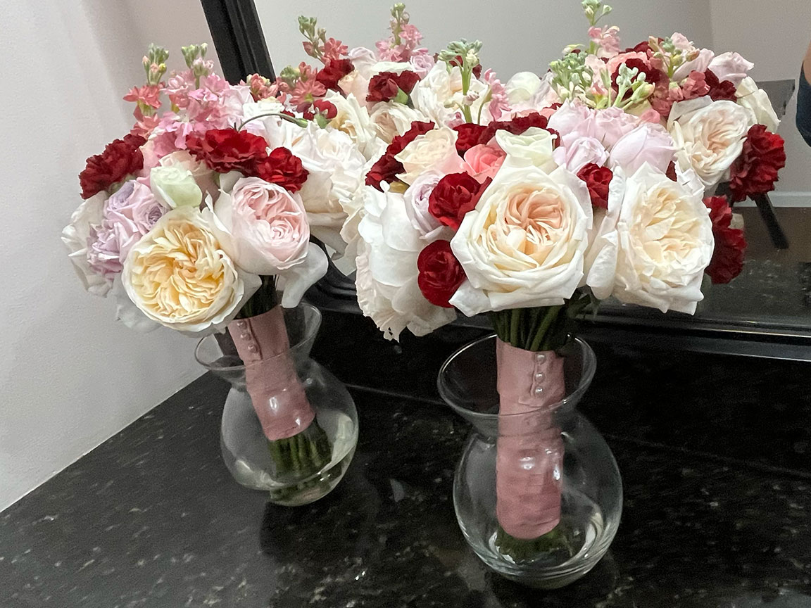 Bridesmaid flowers, in vases.