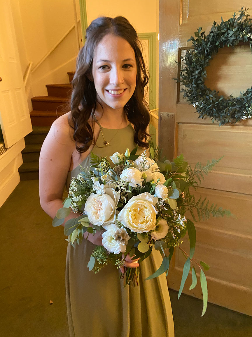 Bridesmaid with flowers.