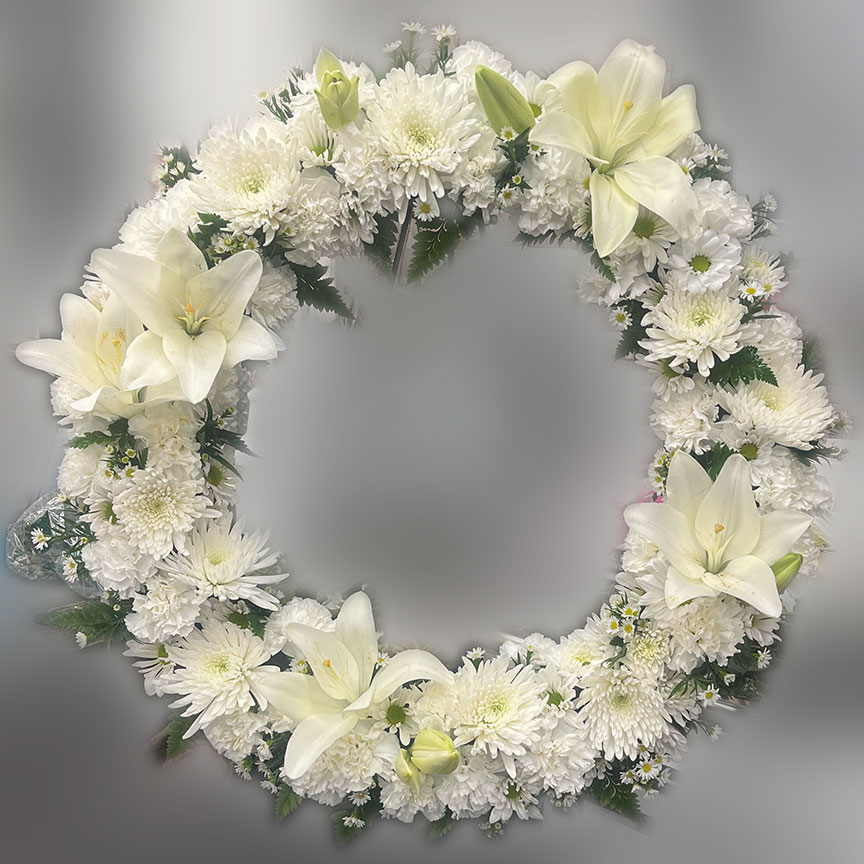Circular flower wreath with white flowers.