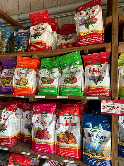 Espoma products on shelf.