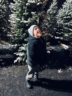 Catching snowflakes on tongue.
