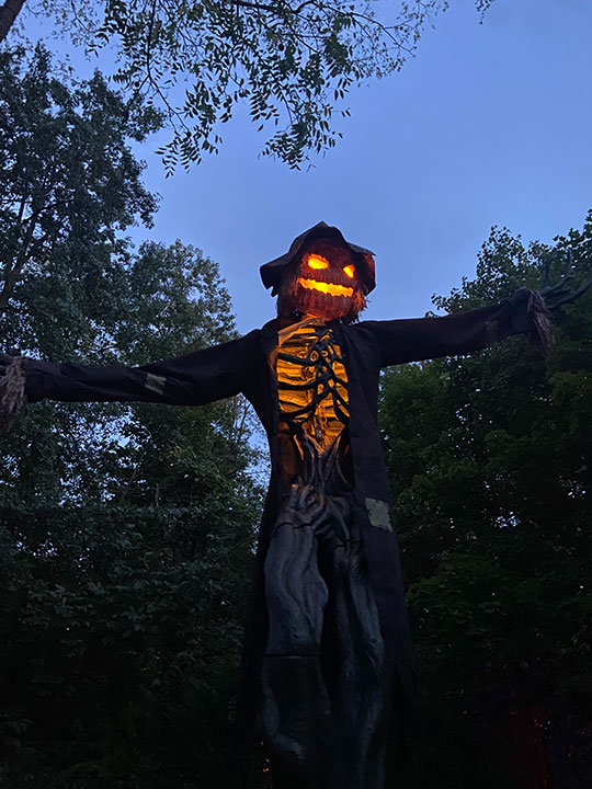 scary scarecrow at night at Colonial Gardens.